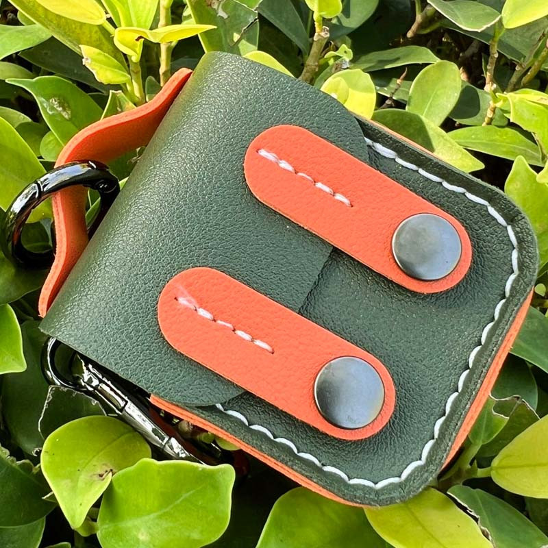 Фото Кожаный футляр Briefcase для наушников AirPods 1/2 (Green / Orange) в магазине vchehle.ua